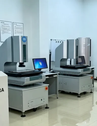 Two Coordinate Measuring Machines (CMM) in a digitized quality control and metrology lab.