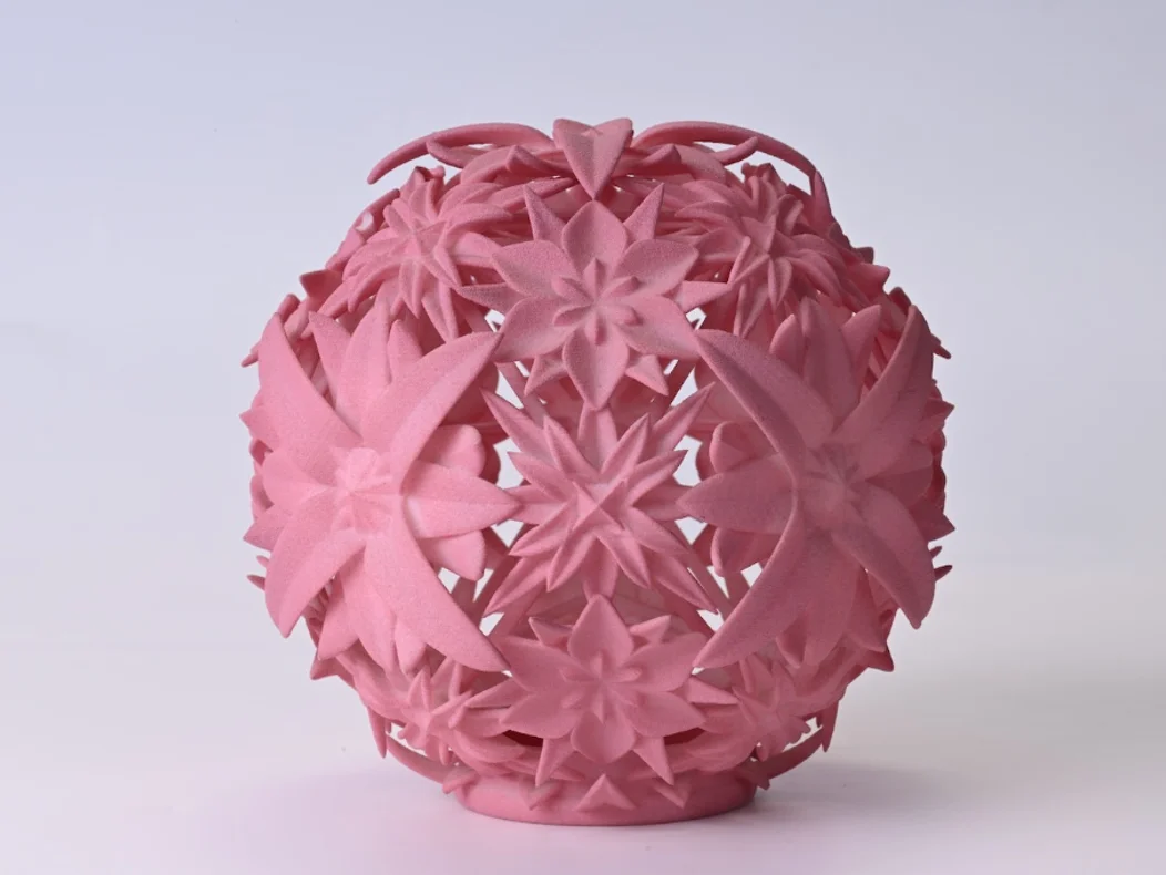 Hollow geometric sphere with interlocking floral patterns